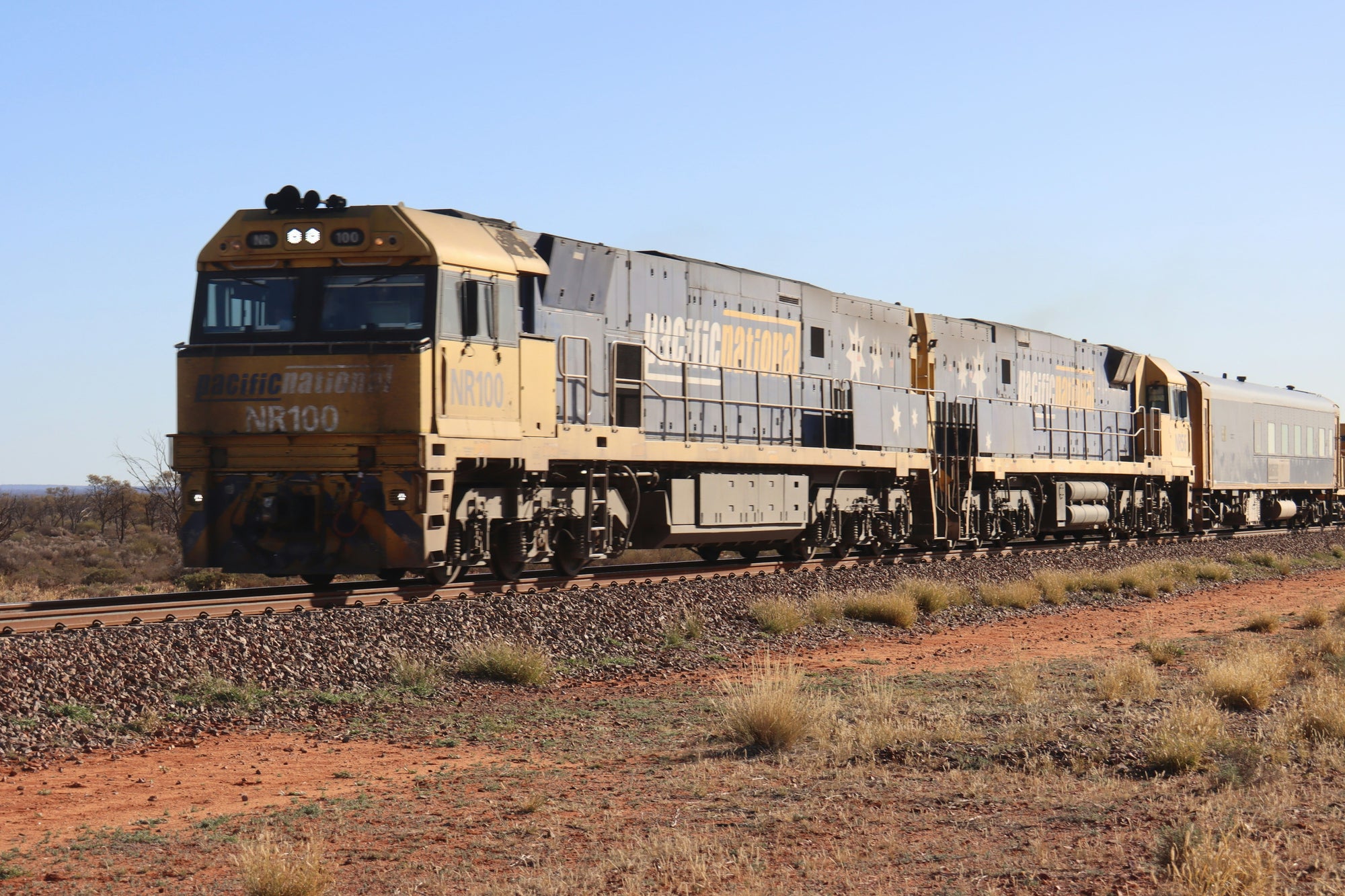Lycopodium client Pacific National Diesel Locomotive travelling through the Australian outback  | Ribbon Gang Agency Asia + Oceania