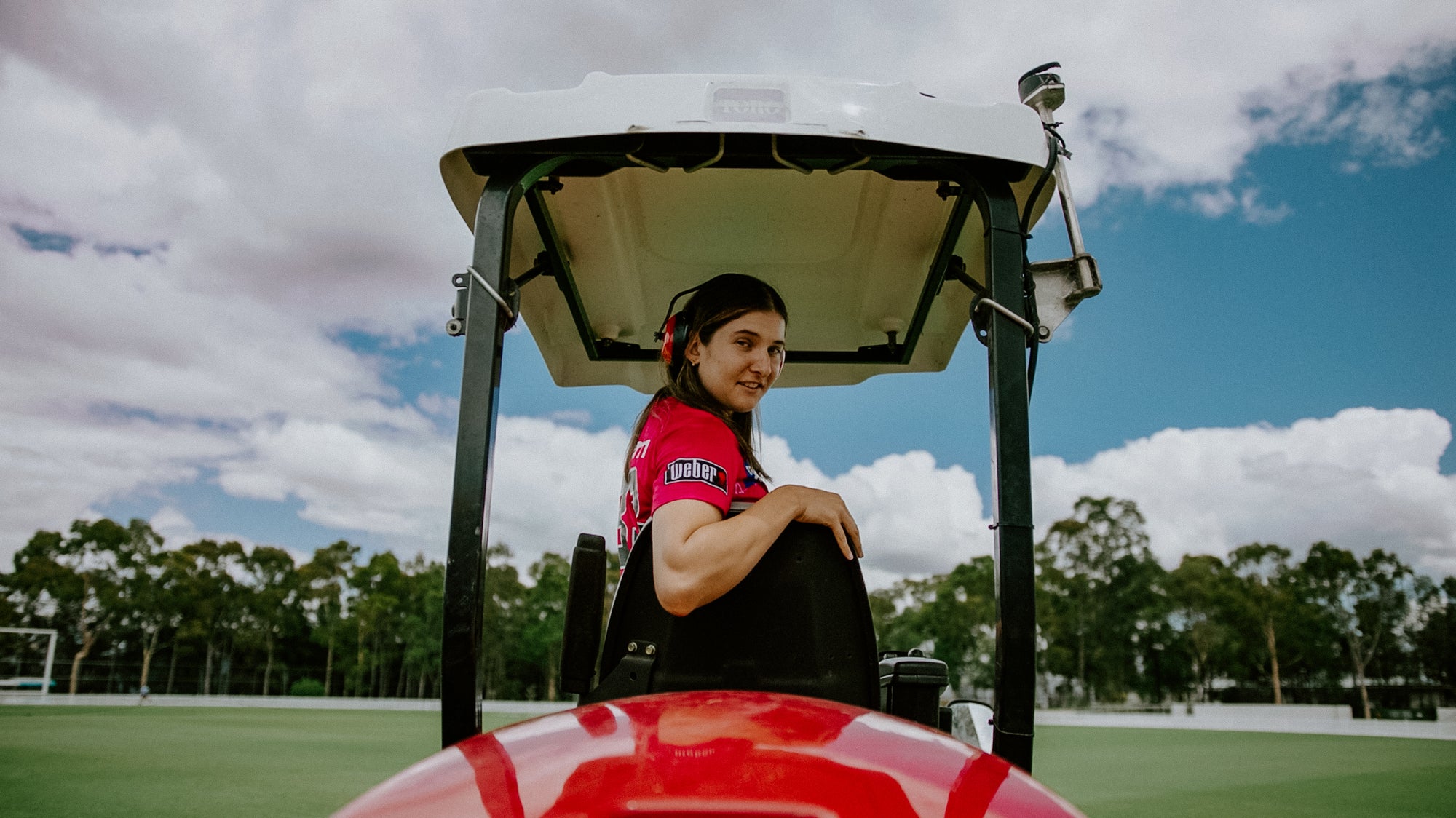 Female Cricketer Driving Vehicle on Cricket Pitch | Ribbon Gang Agency Asia + Oceania